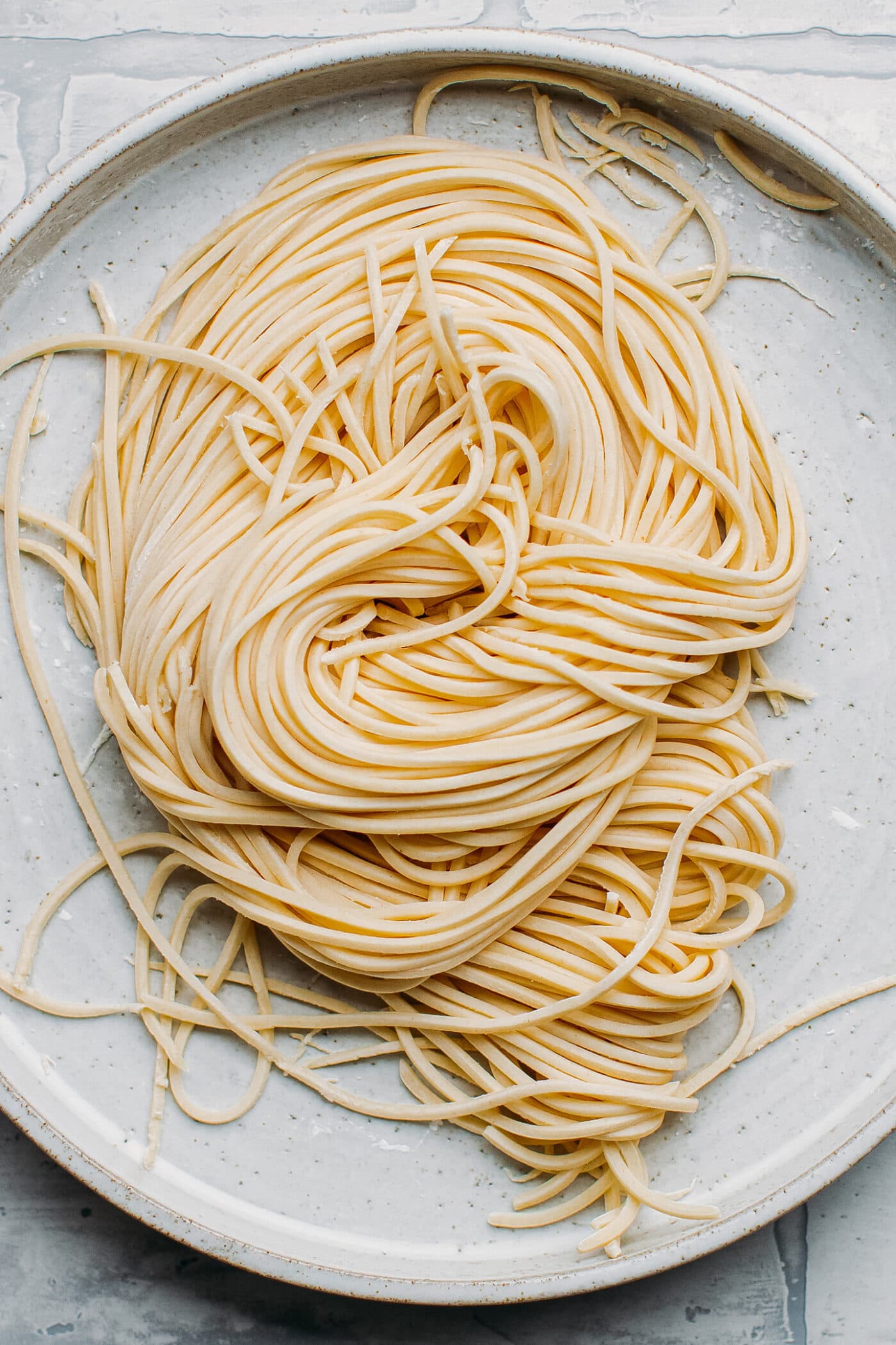 Uncooked ramen noodles on a plate.