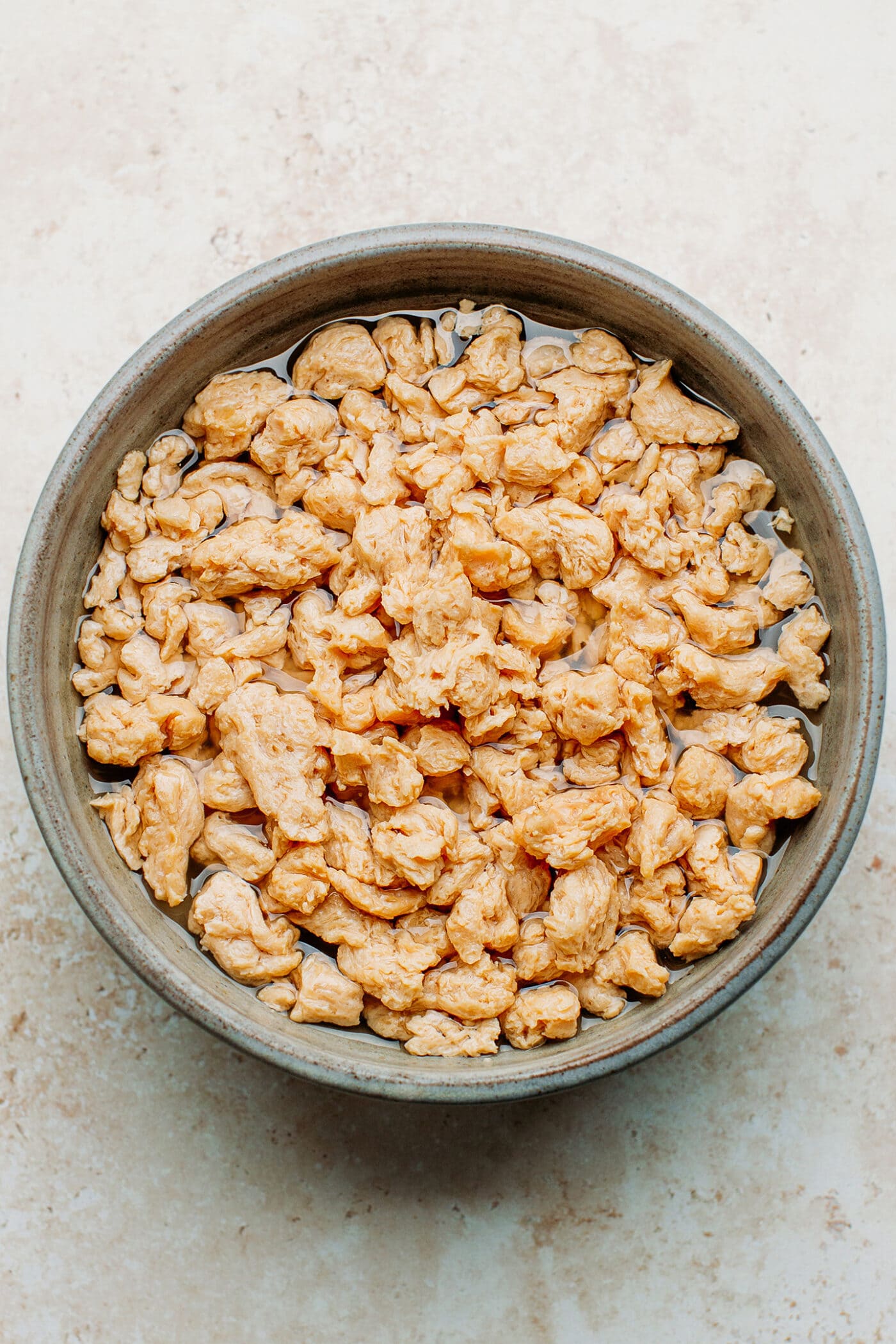 Soaking soy curls in water.