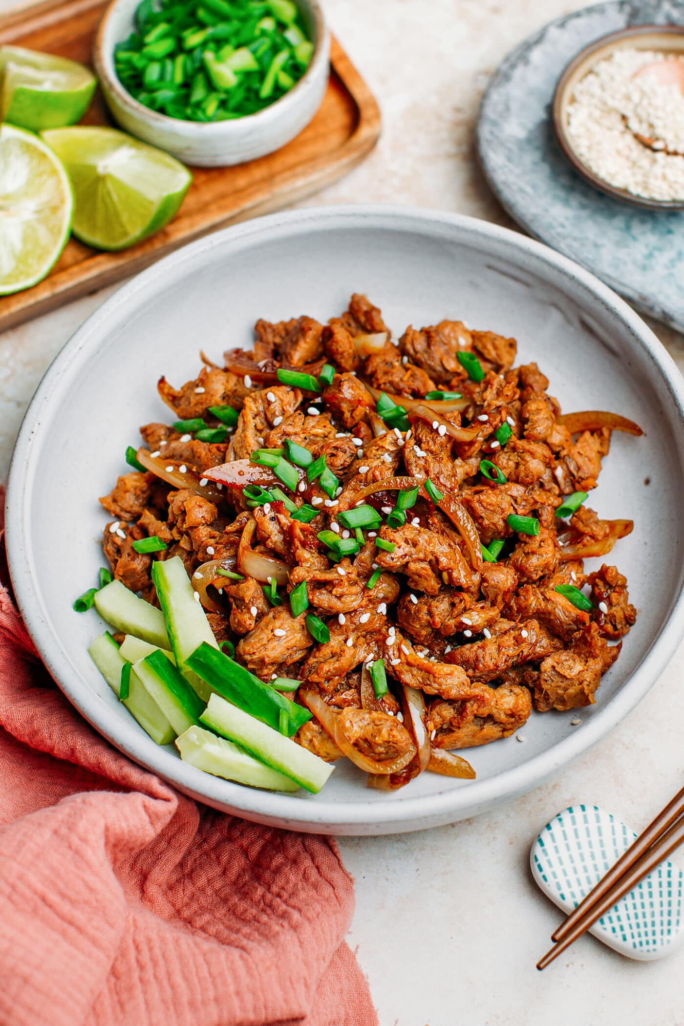 Vegan bulgogi soy curls topped with green onions and sesame seeds.