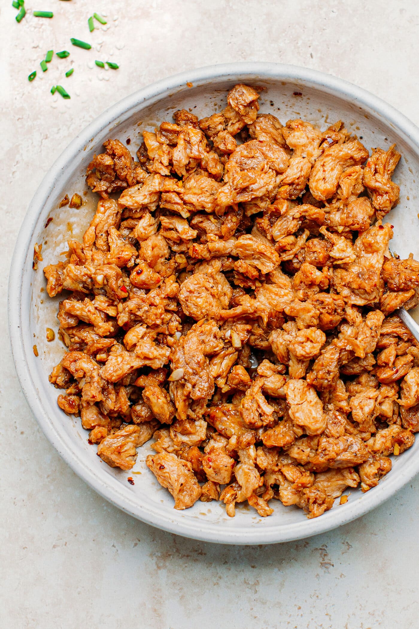 Soy curls marinated with soy sauce, ginger, garlic, and sesame oil.