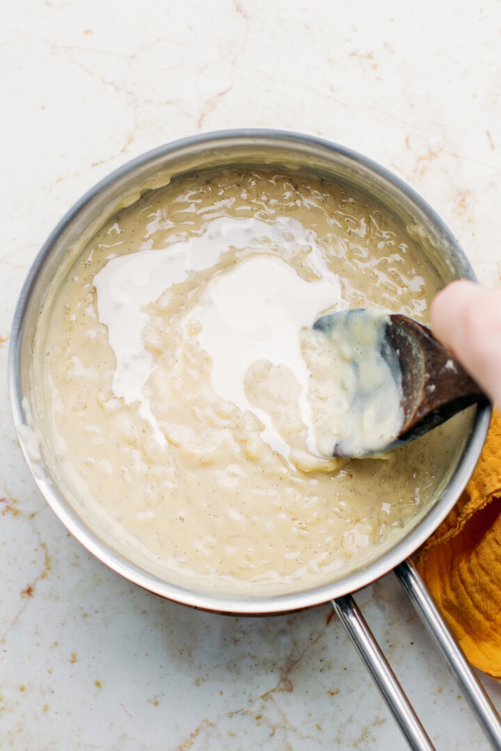 Stirring coconut cream into rice pudding.