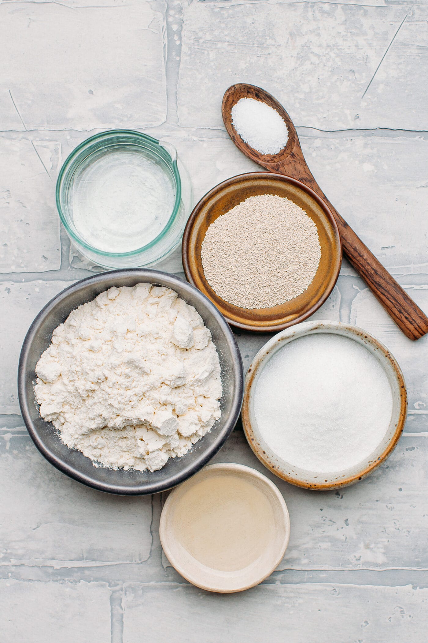 Ingredients like flour, sugar, oil, and yeast.