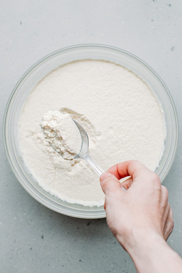 Curdled cashew milk in a bowl.