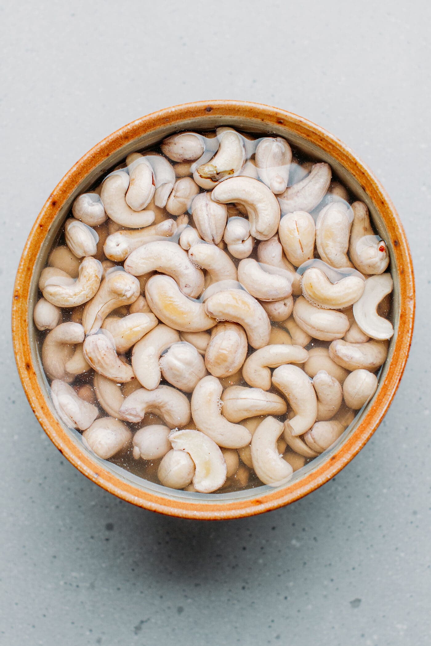 Raw cashews soaking in water.