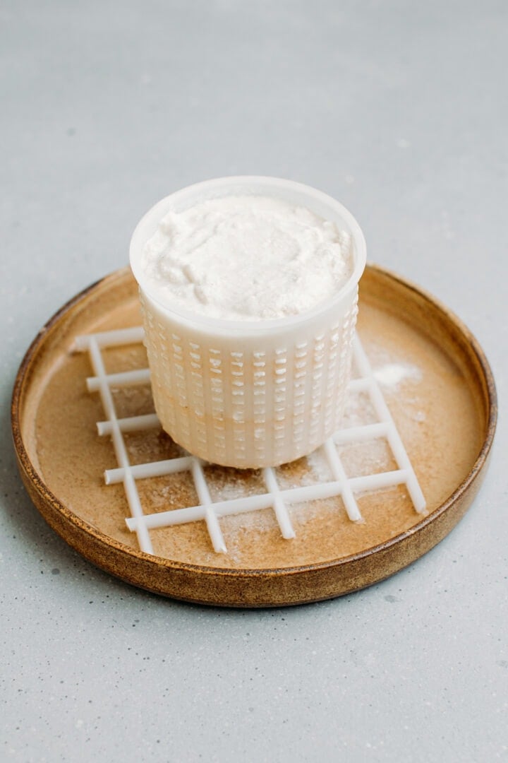 Draining ricotta in a basket.