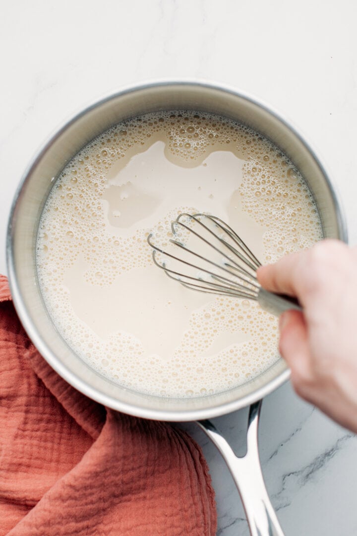 Whisking cornstarch in almond milk.