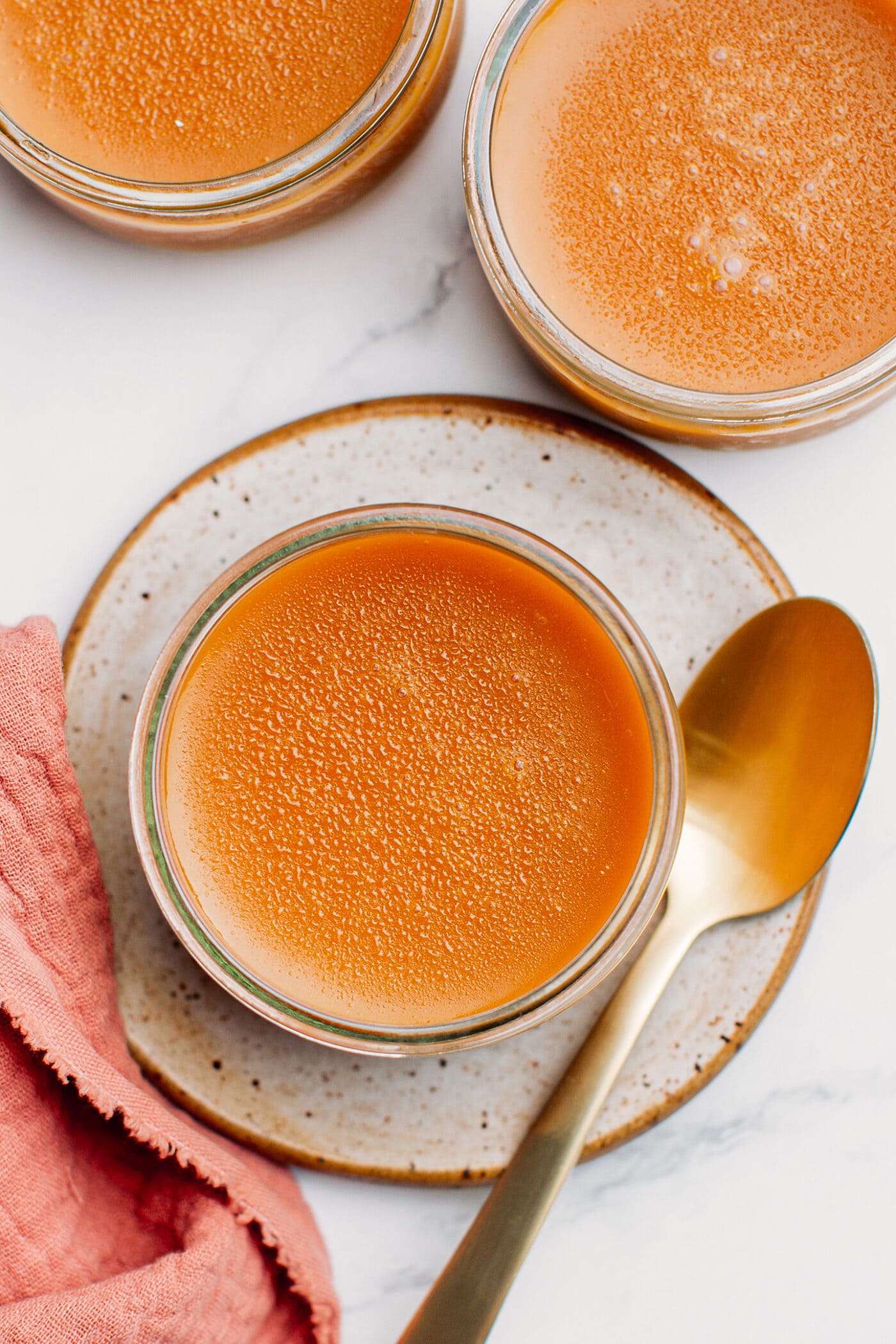 Top view of vegan caramel pots de crème.