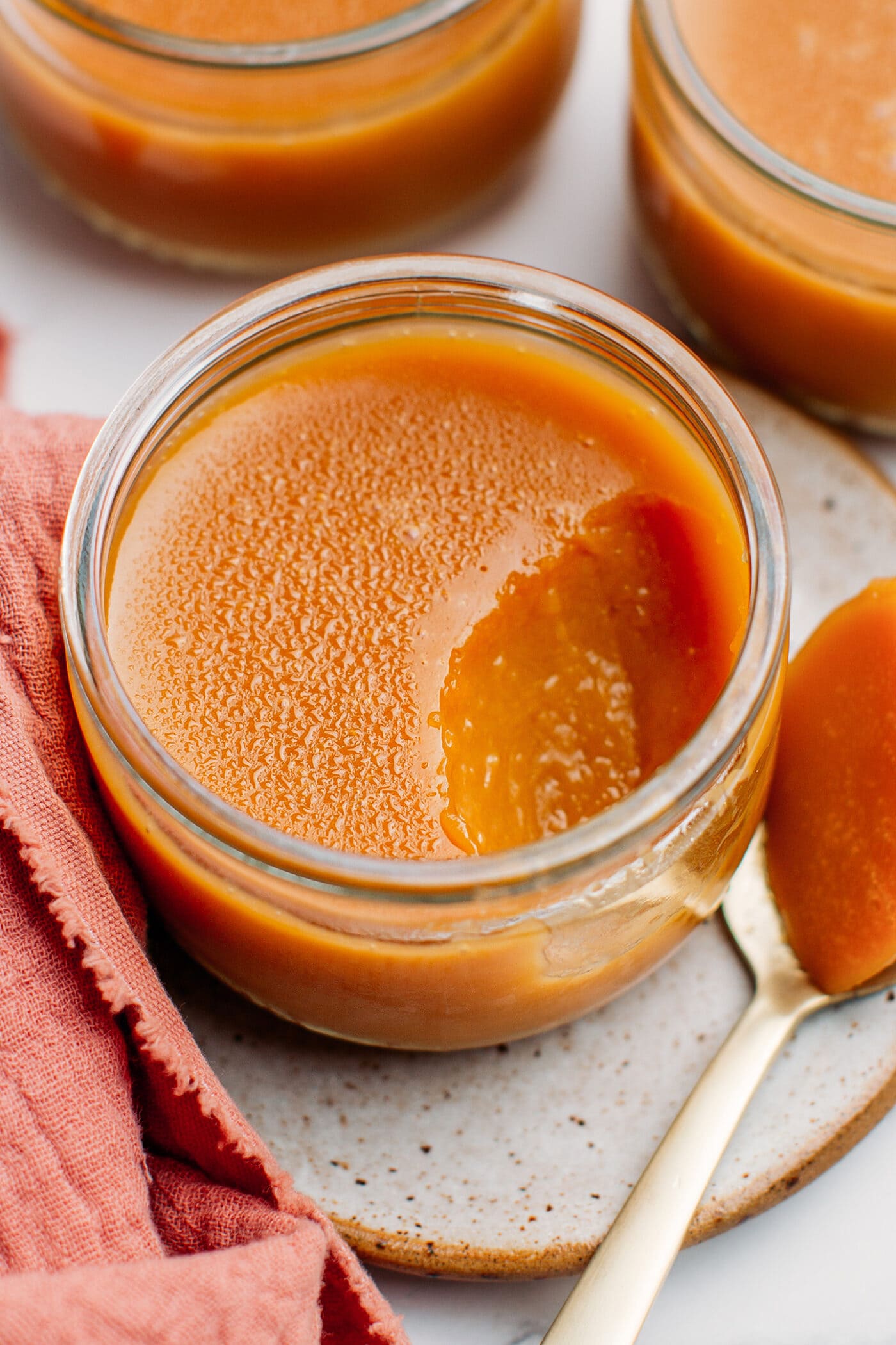 Caramel pot de crème in a small ramekin.