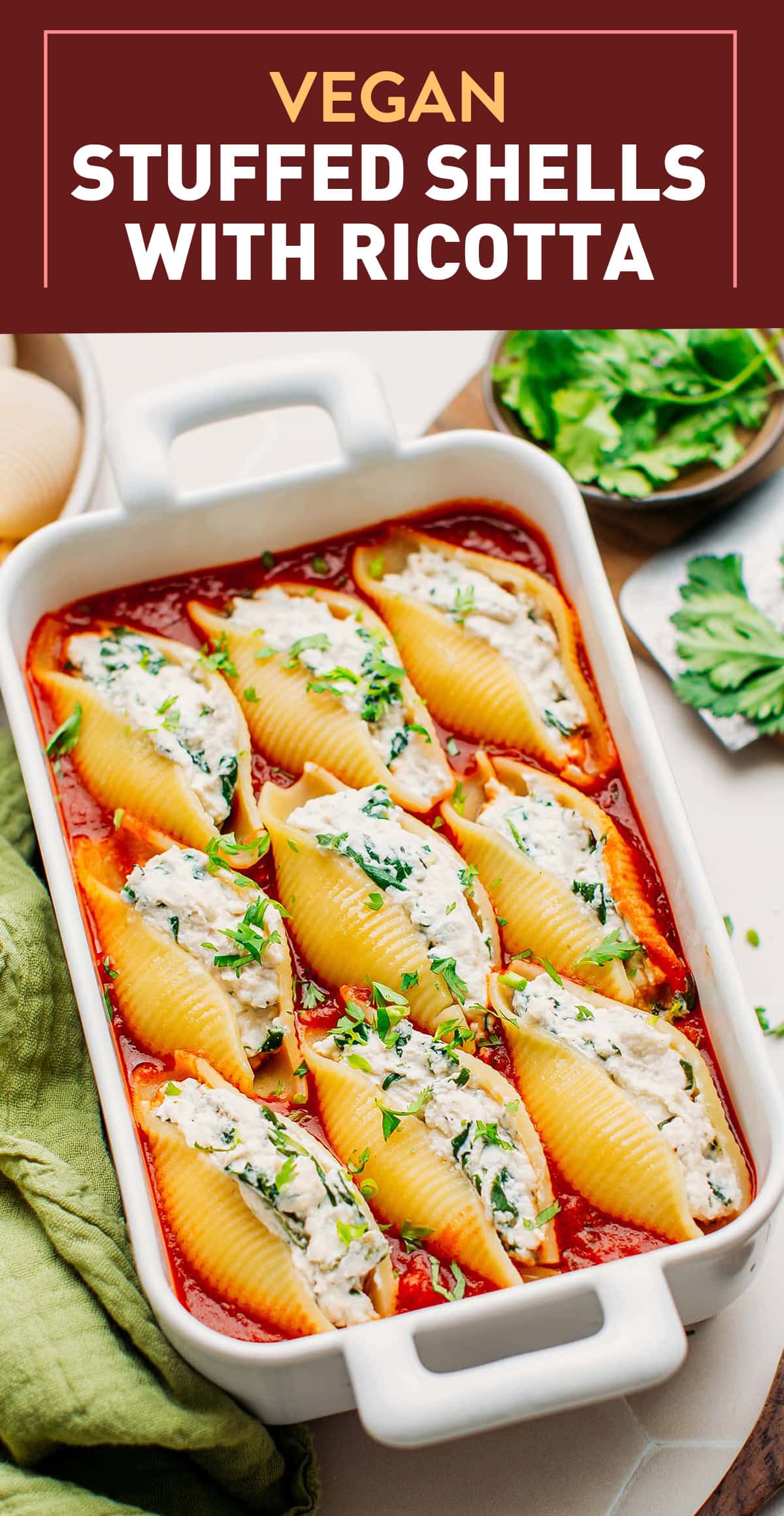 The classic ricotta stuffed shells dish made vegan! This plant-based version is just as delicious, satisfying, and comforting! These vegan stuffed shells are filled with a creamy ricotta and spinach filling and baked in plenty of marinara sauce! #stuffedshells #vegan #Plantbased