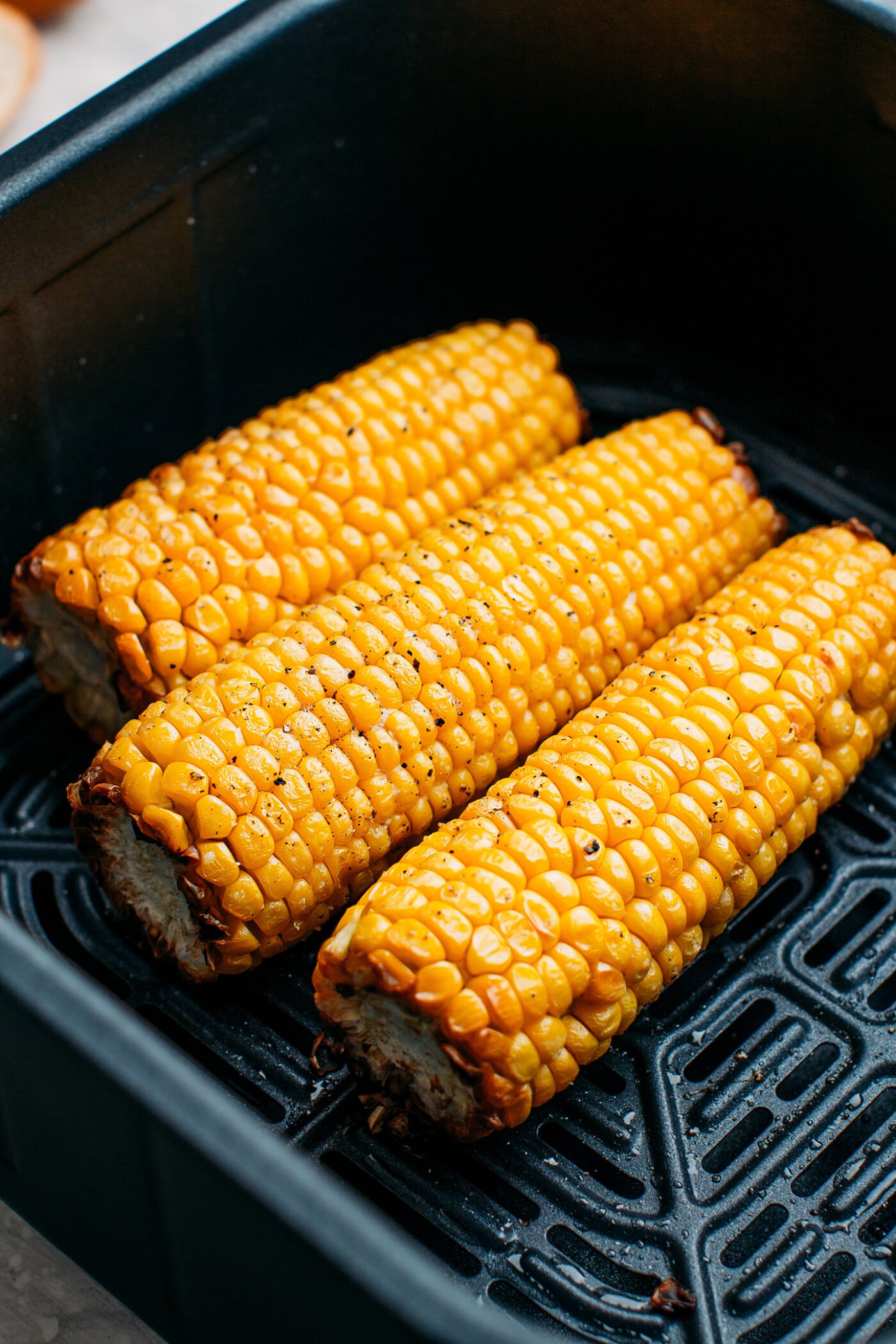 Close-up of air fryer corn on the cob.