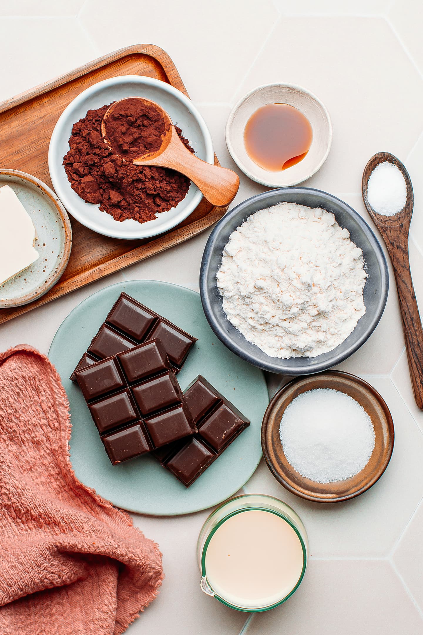 Ingredients like dark chocolate, flour, cocoa powder, sugar, and almond milk.