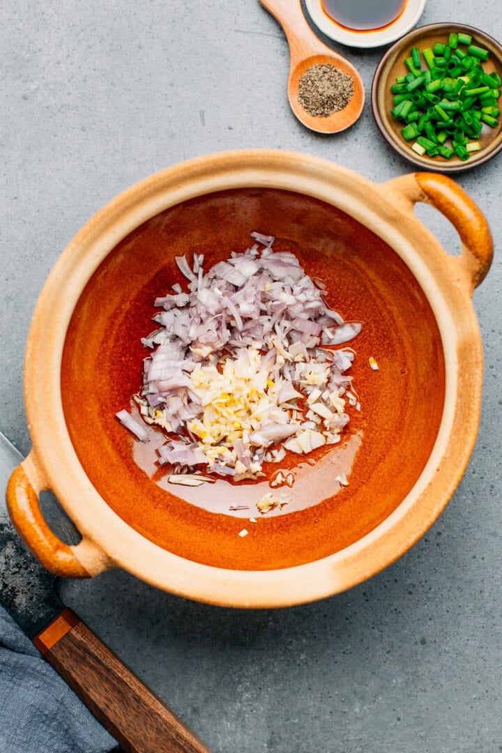 Garlic and shallots in a clay pot.