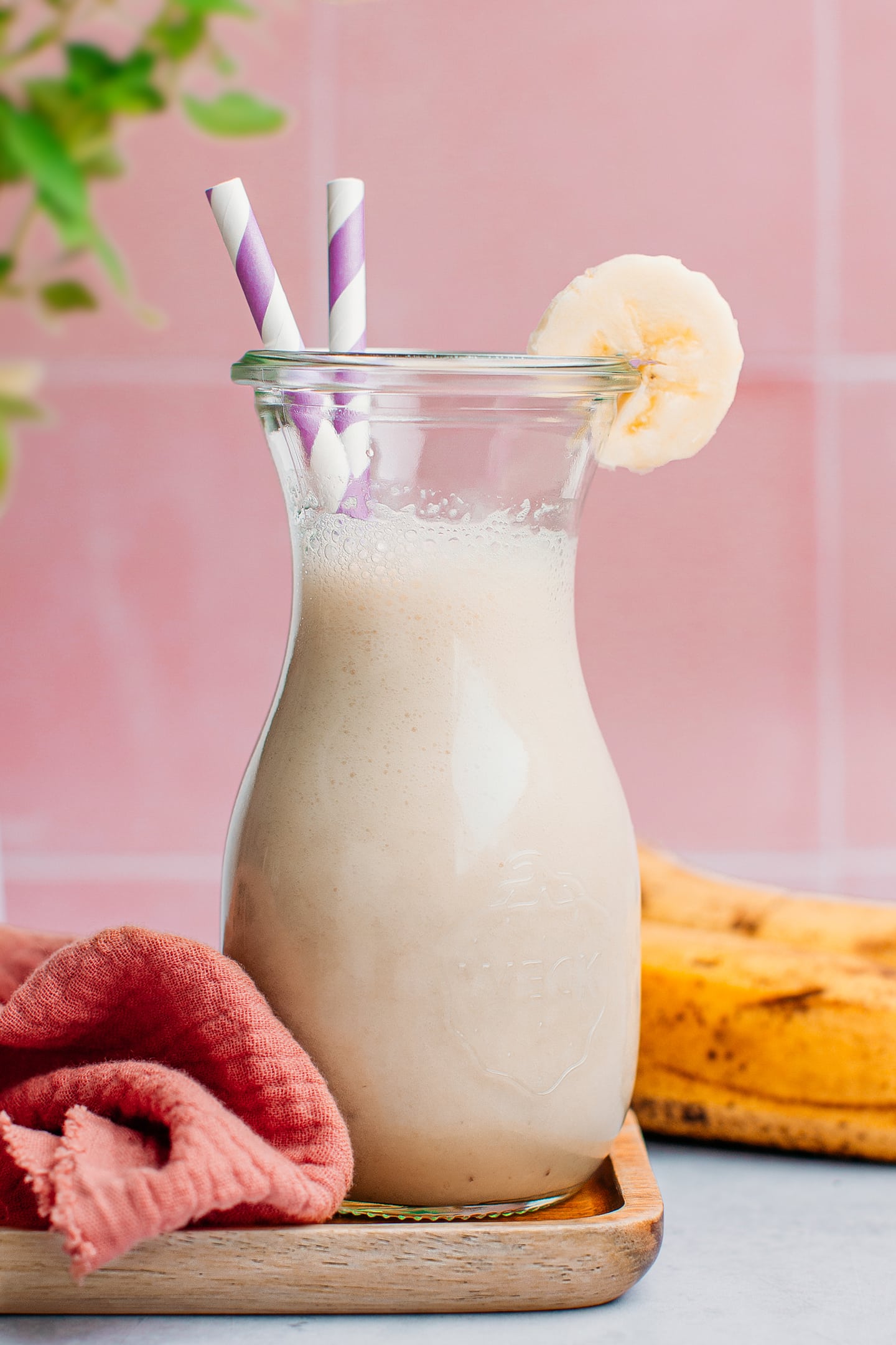 Banana milk in a small glass bottle.