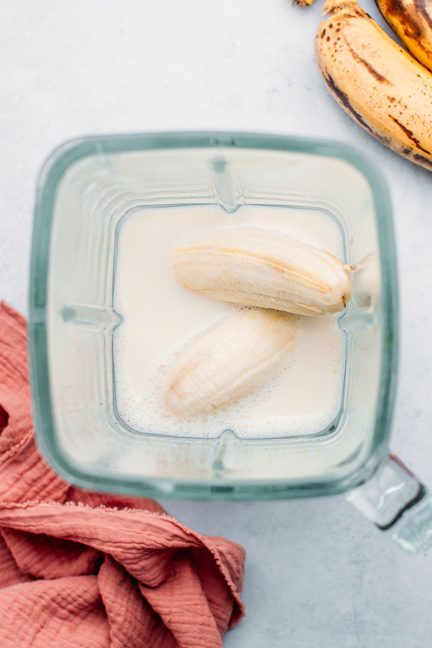 Bananas and milk in a blender.