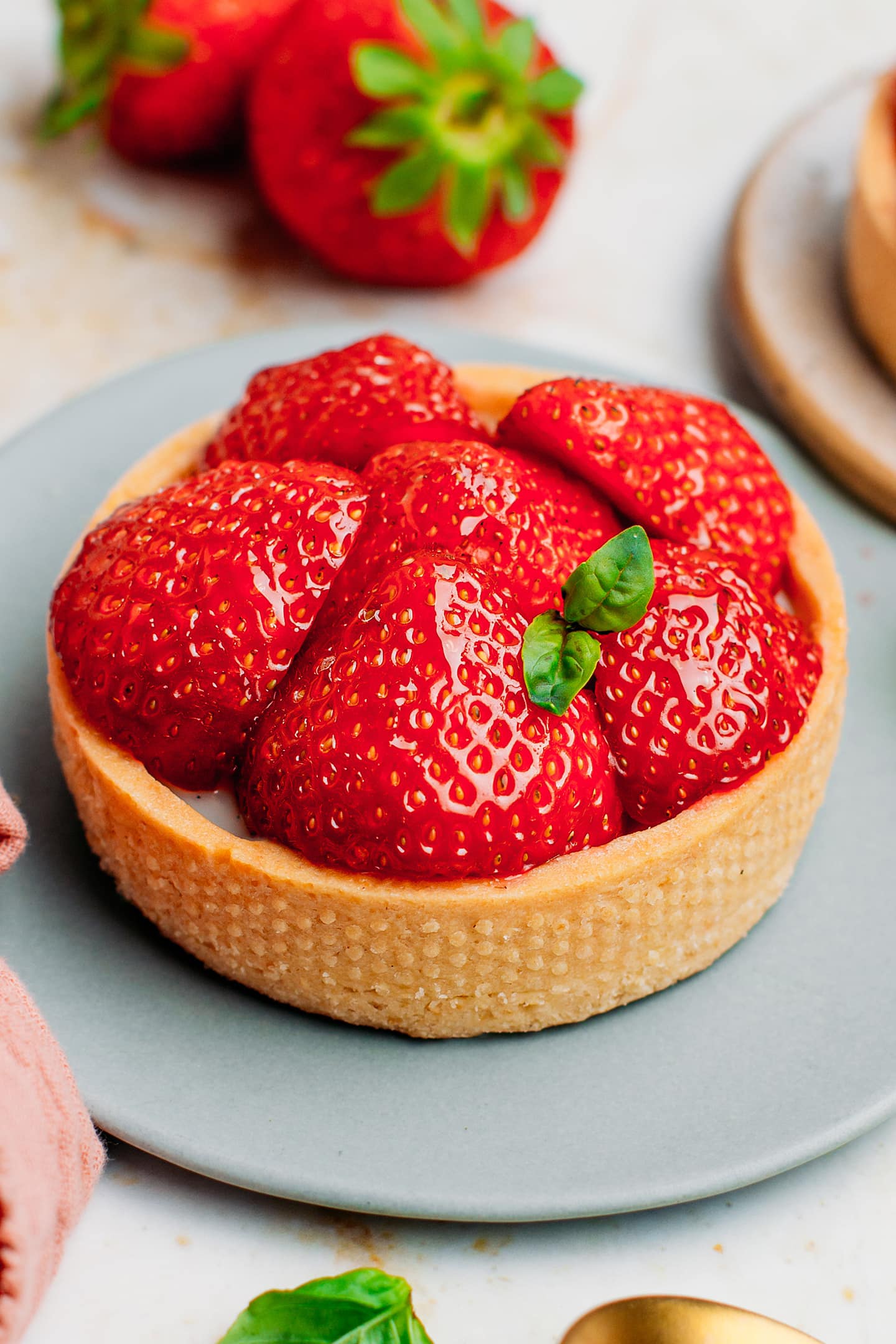 Strawberry tartlets with fresh strawberry and pastry cream.