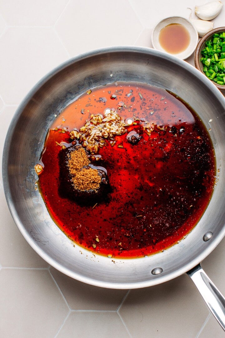 Soy sauce, sugar, garlic, and ginger in a skillet.