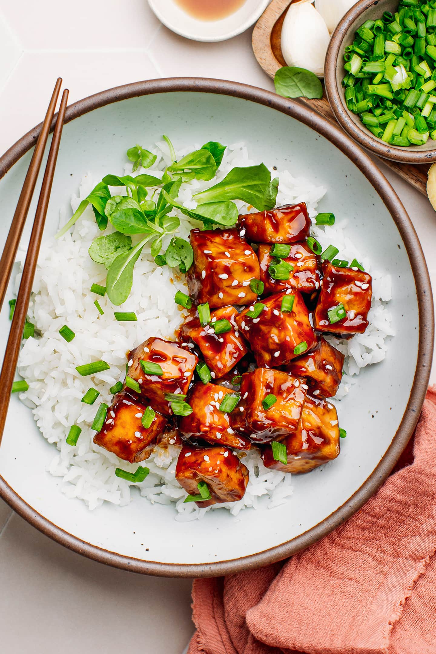 Teriyaki tofu over a bed of steamed white rice.