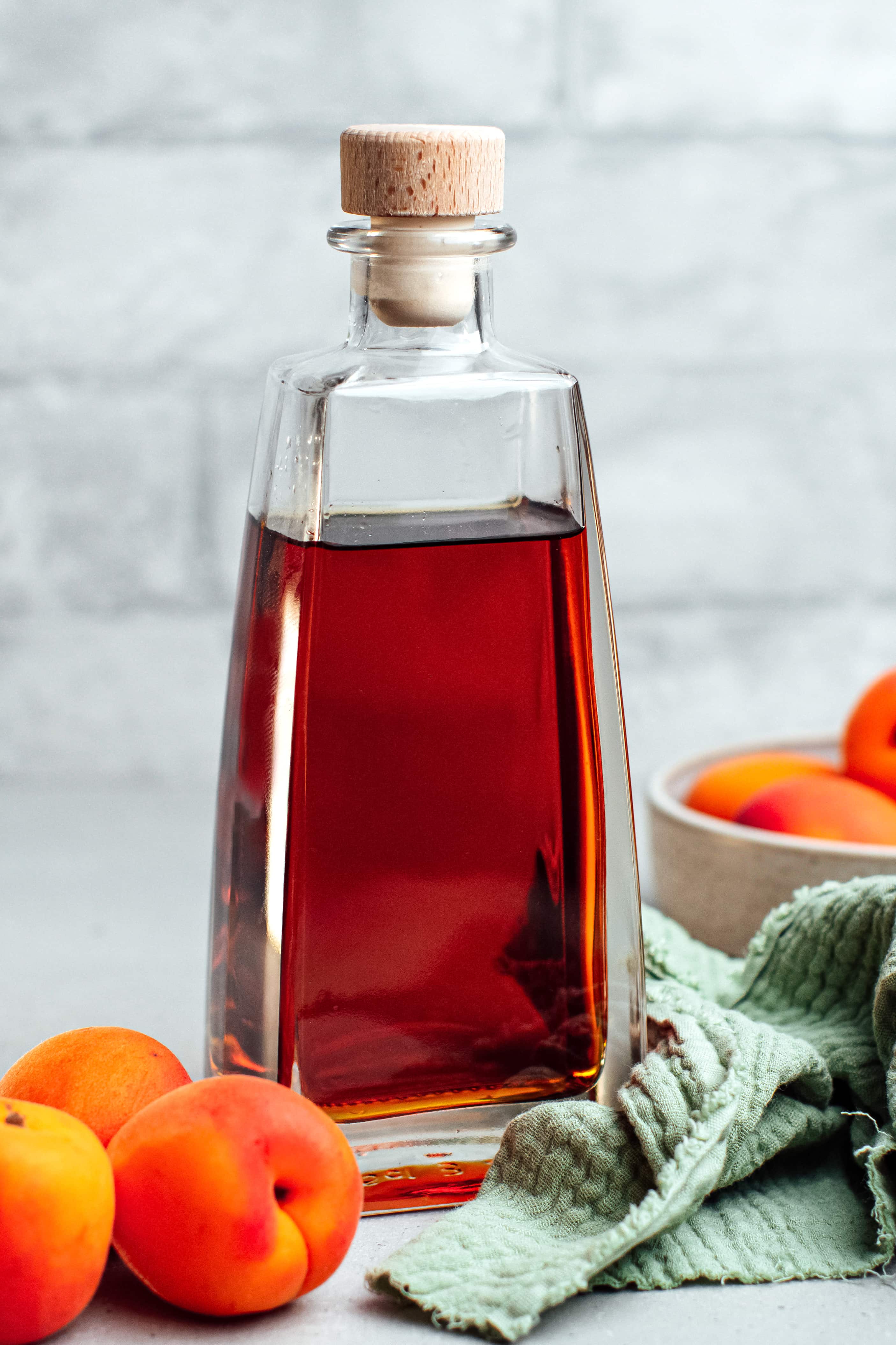 Glass bottle of homemade apricot liqueur.