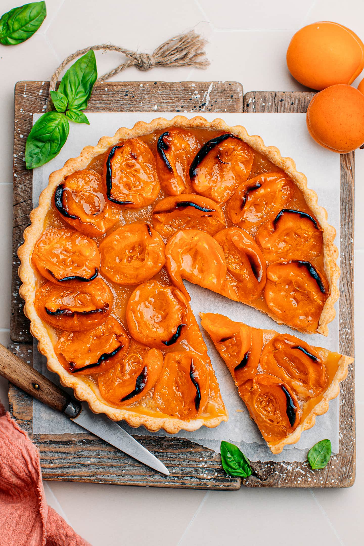 Apricot tart on a wooden board.