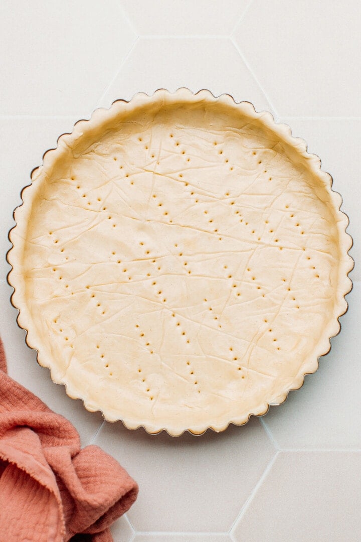Shortcrust pastry pushed into a pie pan.