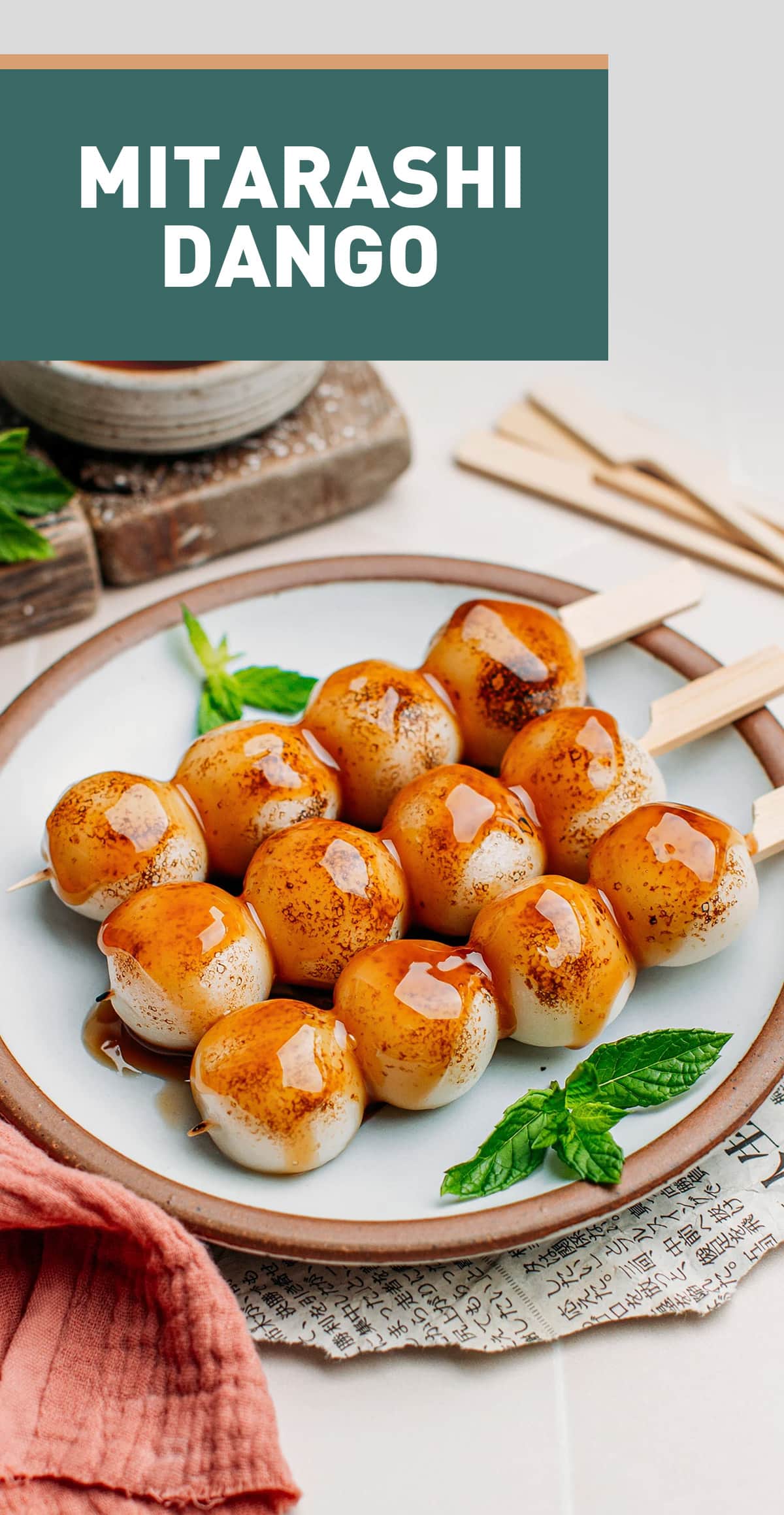 Mitarashi dango is a Japanese treat that consists of charred rice dumplings glazed with a sweet and salty sauce. It's chewy, toasty, and fun to make! Enjoy this sweet treat as an afternoon snack with tea! #japanese #dango