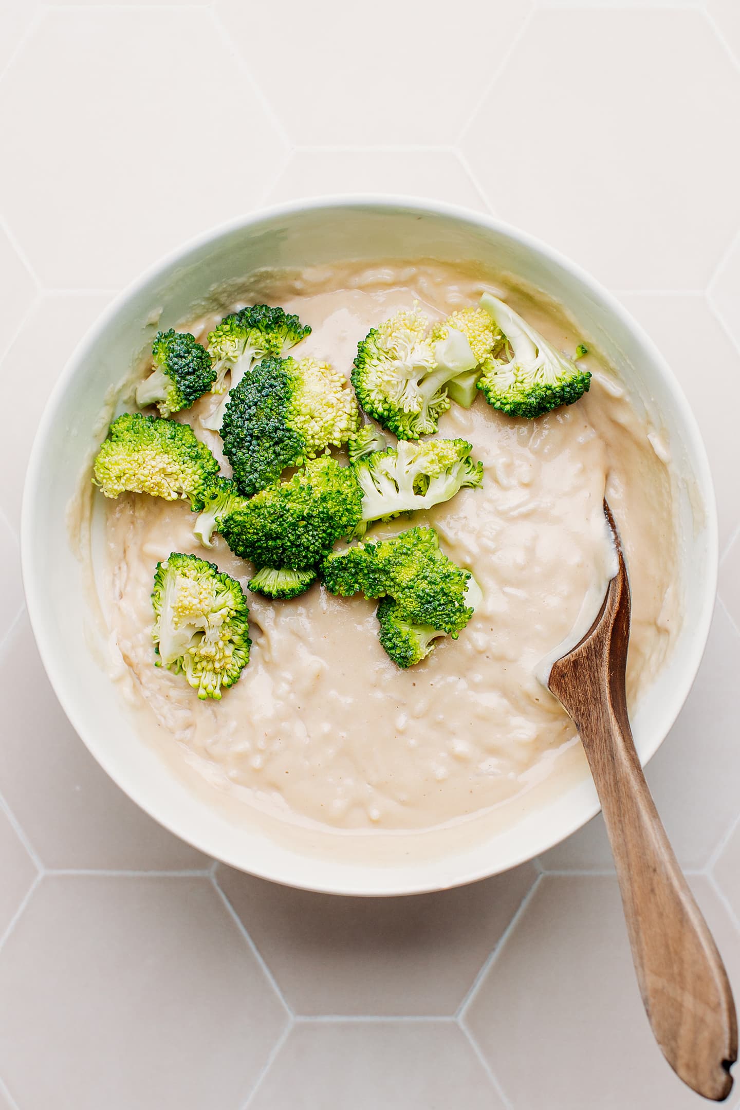 Cheese rice and broccoli in a bowl.