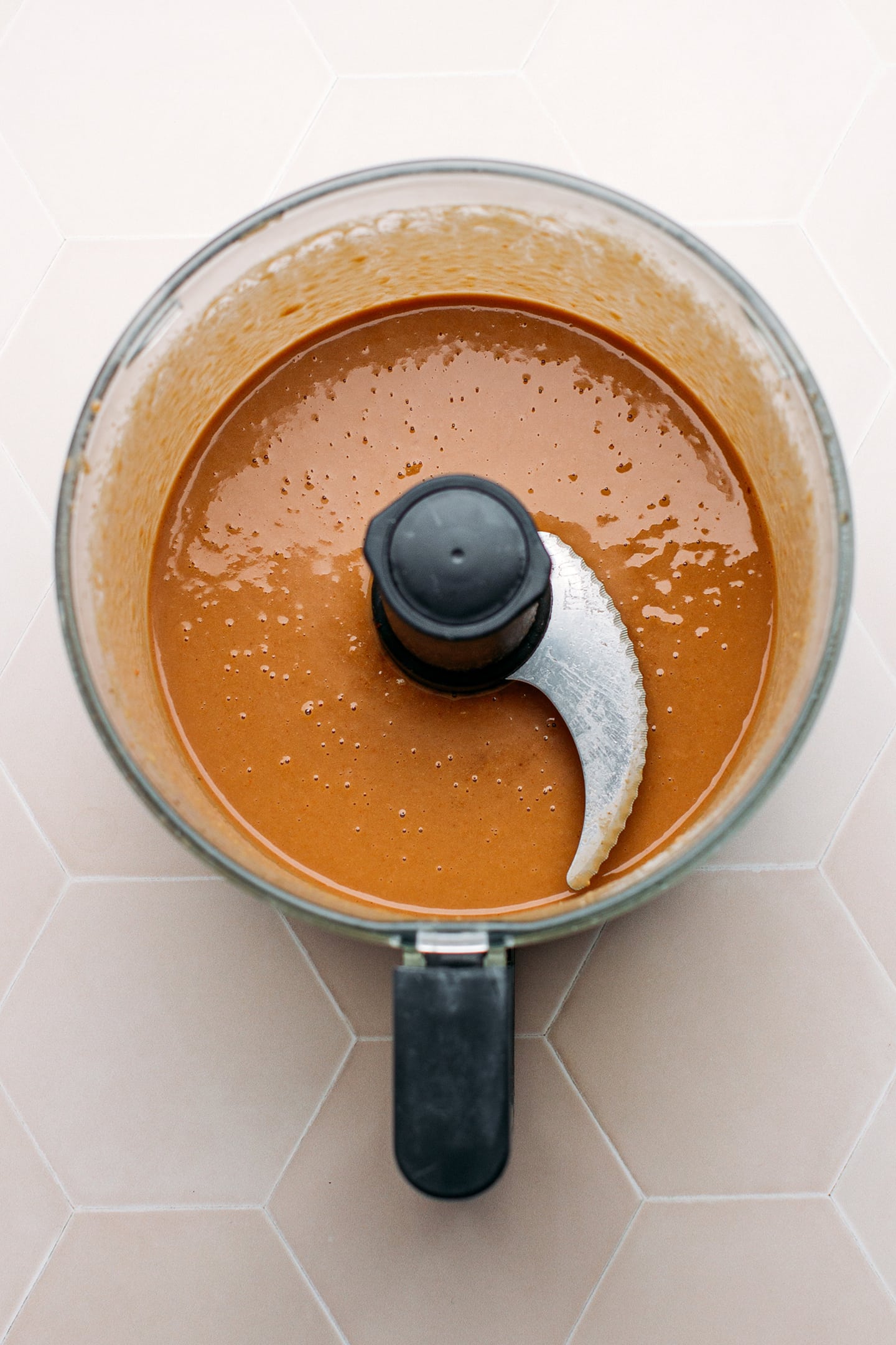 Smooth seasoned bean paste in a food processor.