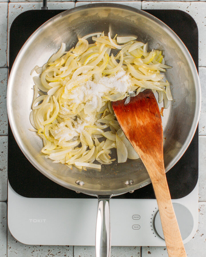 Sautéed onions and sugar in a skillet.