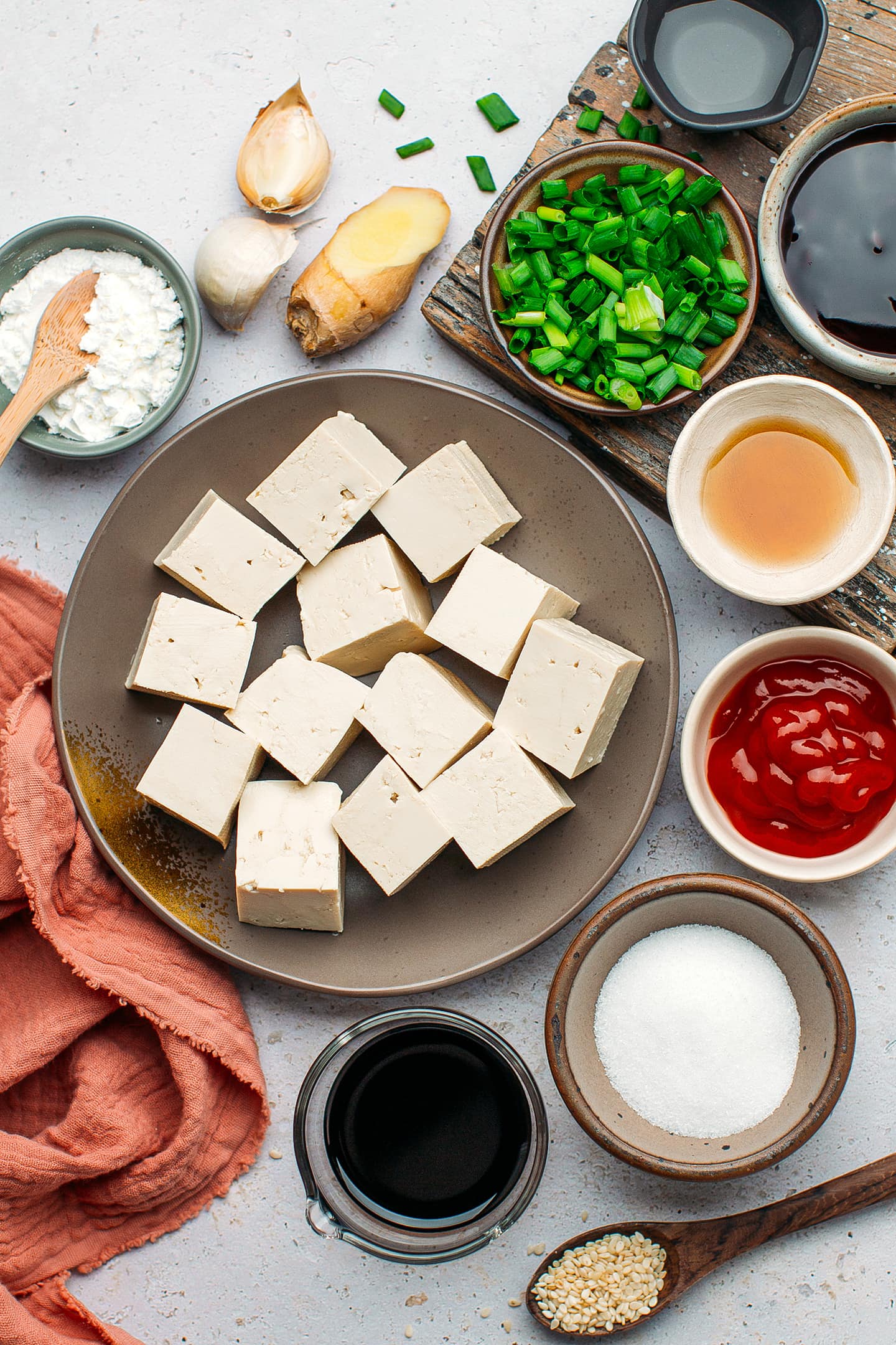 Ingredients like tofu, soy sauce, sugar, and ginger.