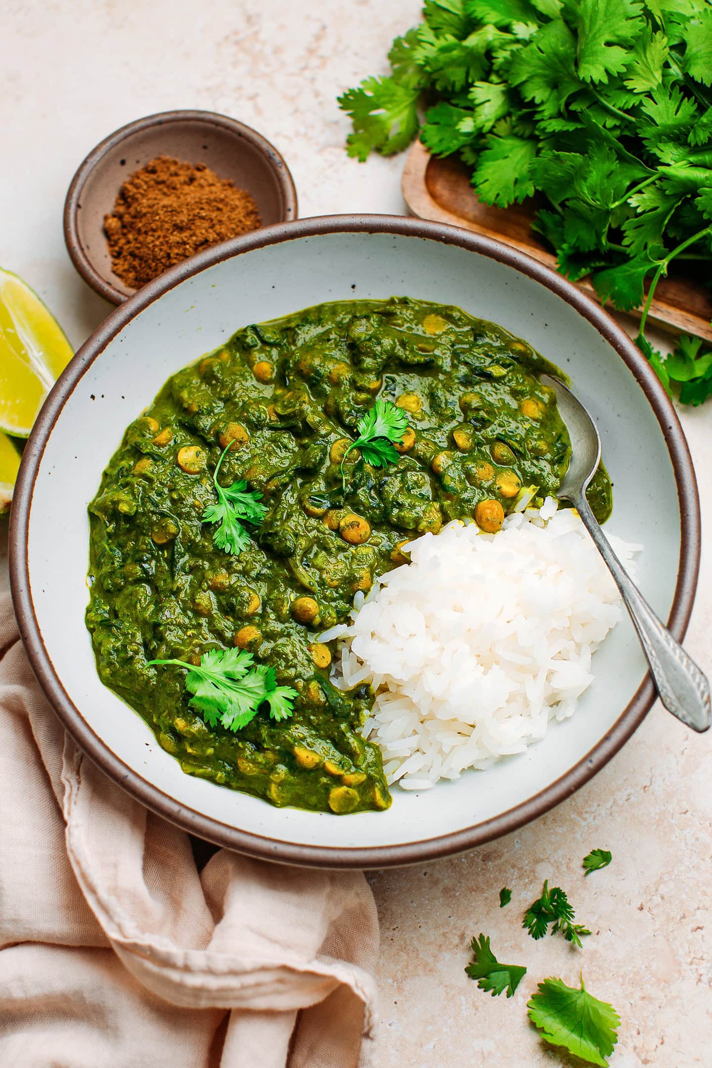 Dal with spinach and rice in a bowl.