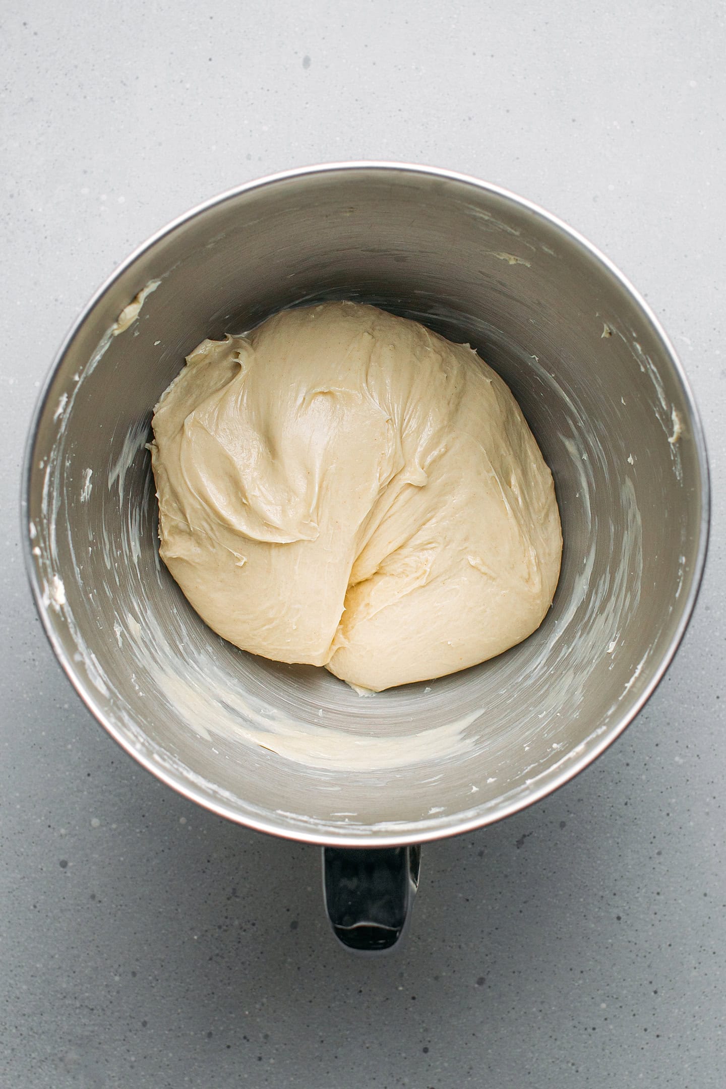 Brioche dough in the bowl of a stand mixer.