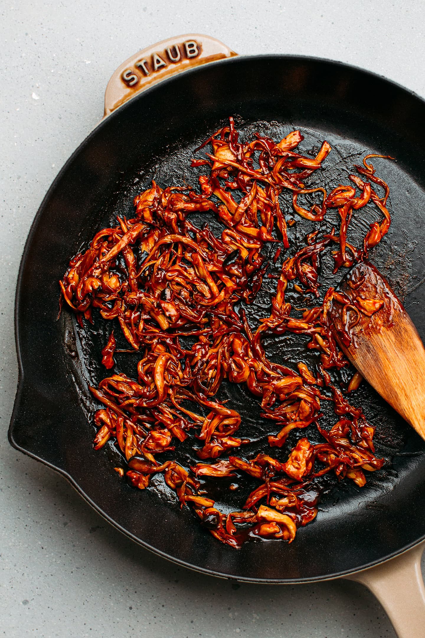 Sautéed BBQ pulled mushrooms in a skillet.