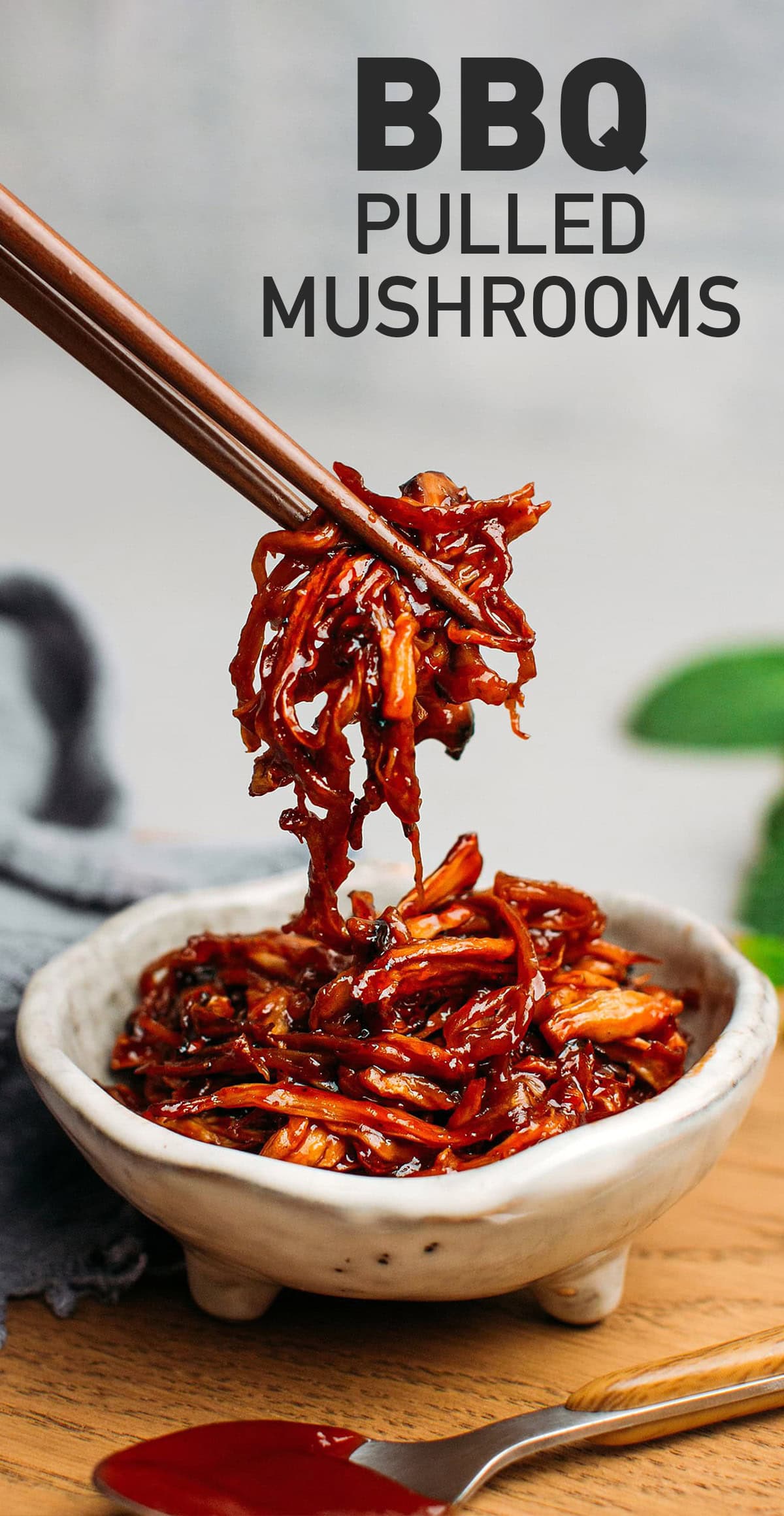 These BBQ pulled mushrooms are saucy, sweet, savory, and smoky! Prepared with baked king oyster mushrooms and homemade barbecue sauce, they make a delicious topping to white rice. They're also perfect for wraps, sandwiches, or burgers! #mushrooms #vegan