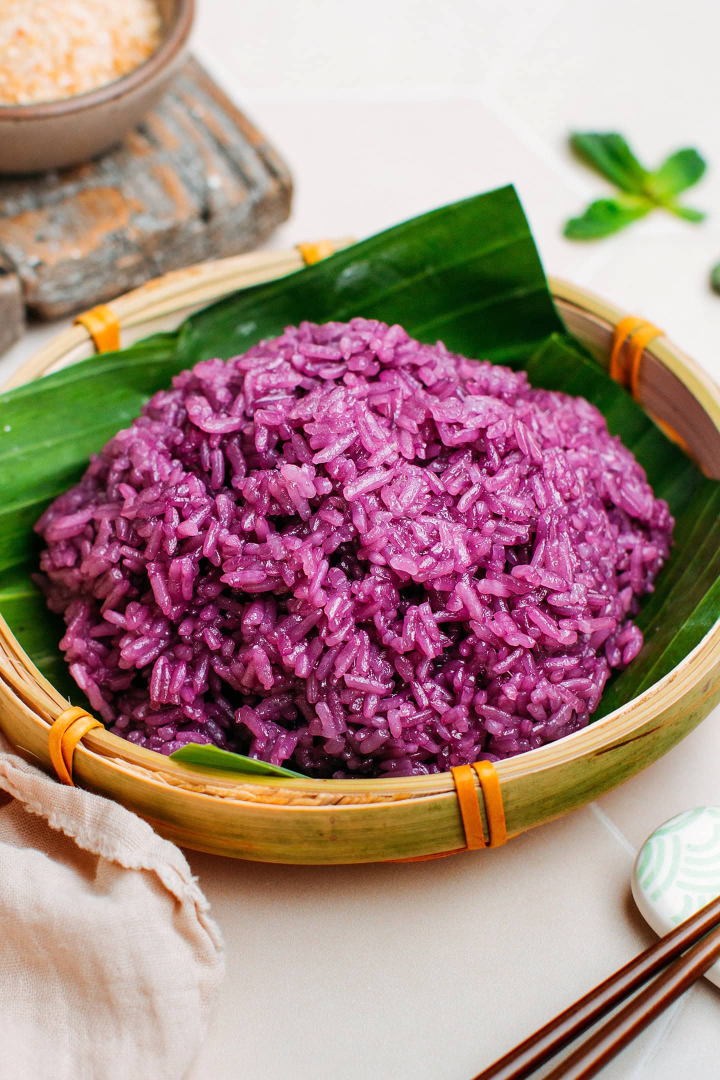 Purple sticky rice in a bamboo platter.