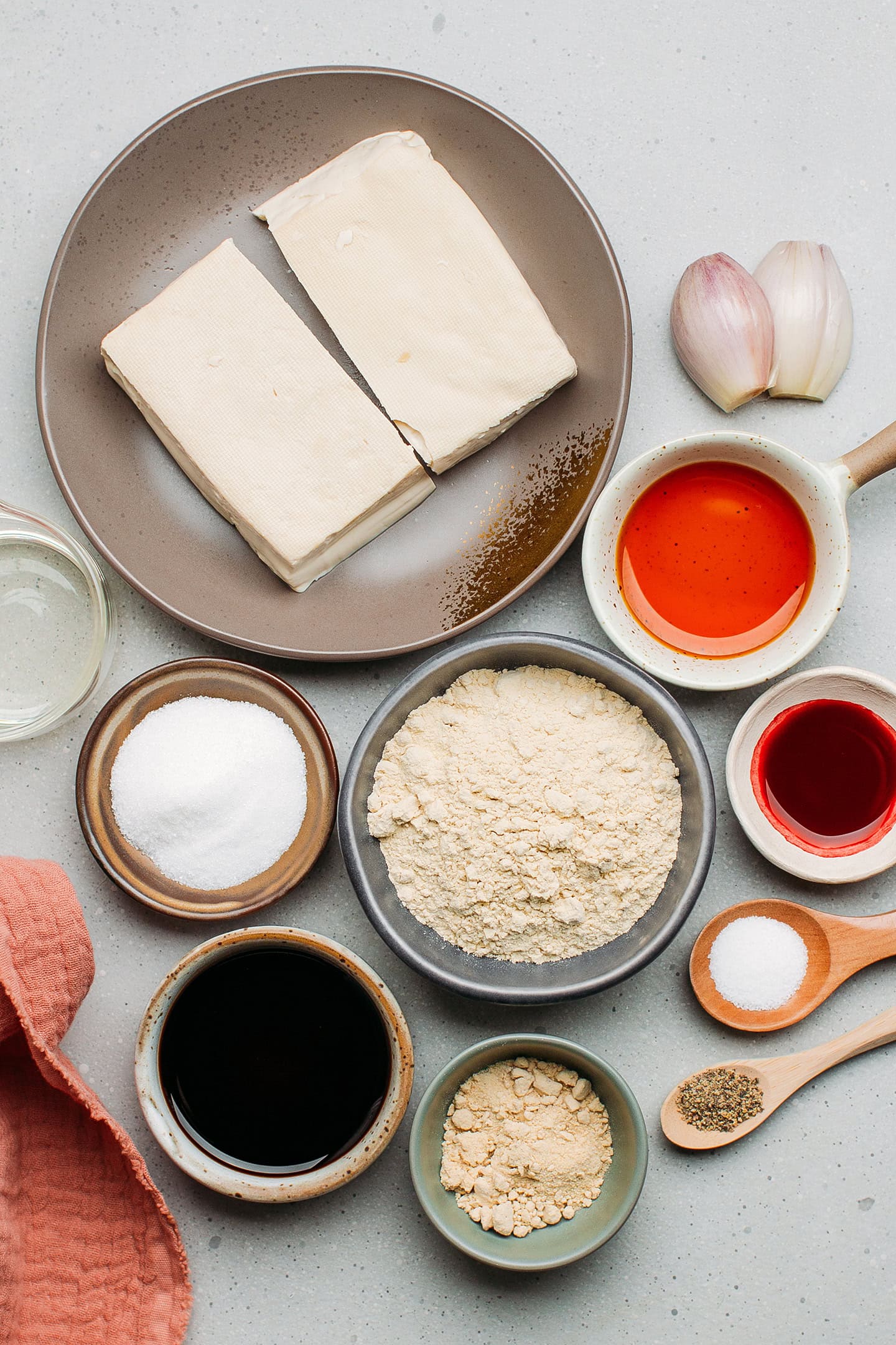 Ingredients like tofu, vital wheat gluten, sugar, soy sauce, and liquid smoke.