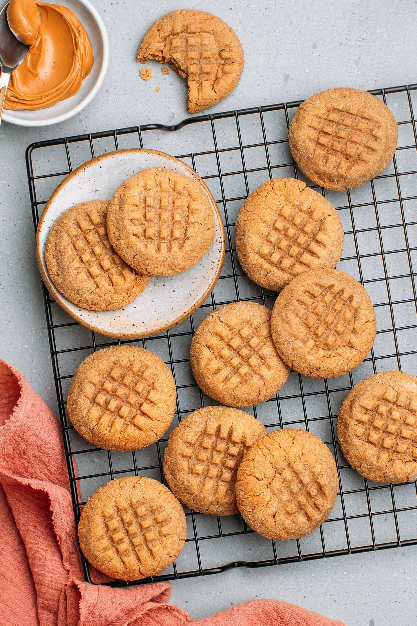 Peanut butter cookies on a cooling rack.