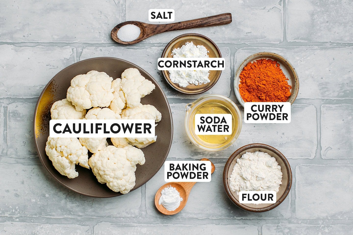 Ingredients like cauliflower, flour, curry powder, and salt.