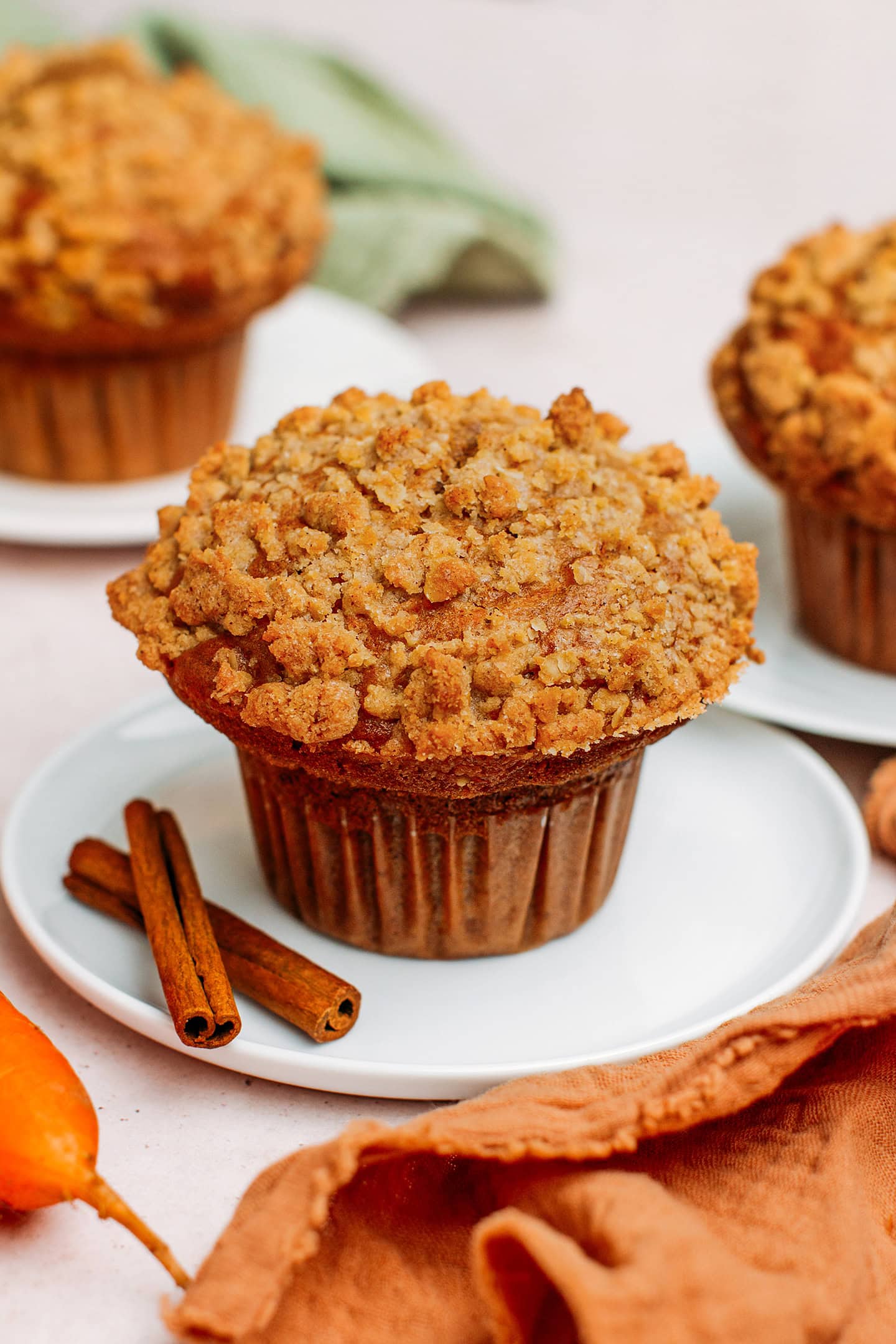 Carrot muffin topped with a crumble topping.