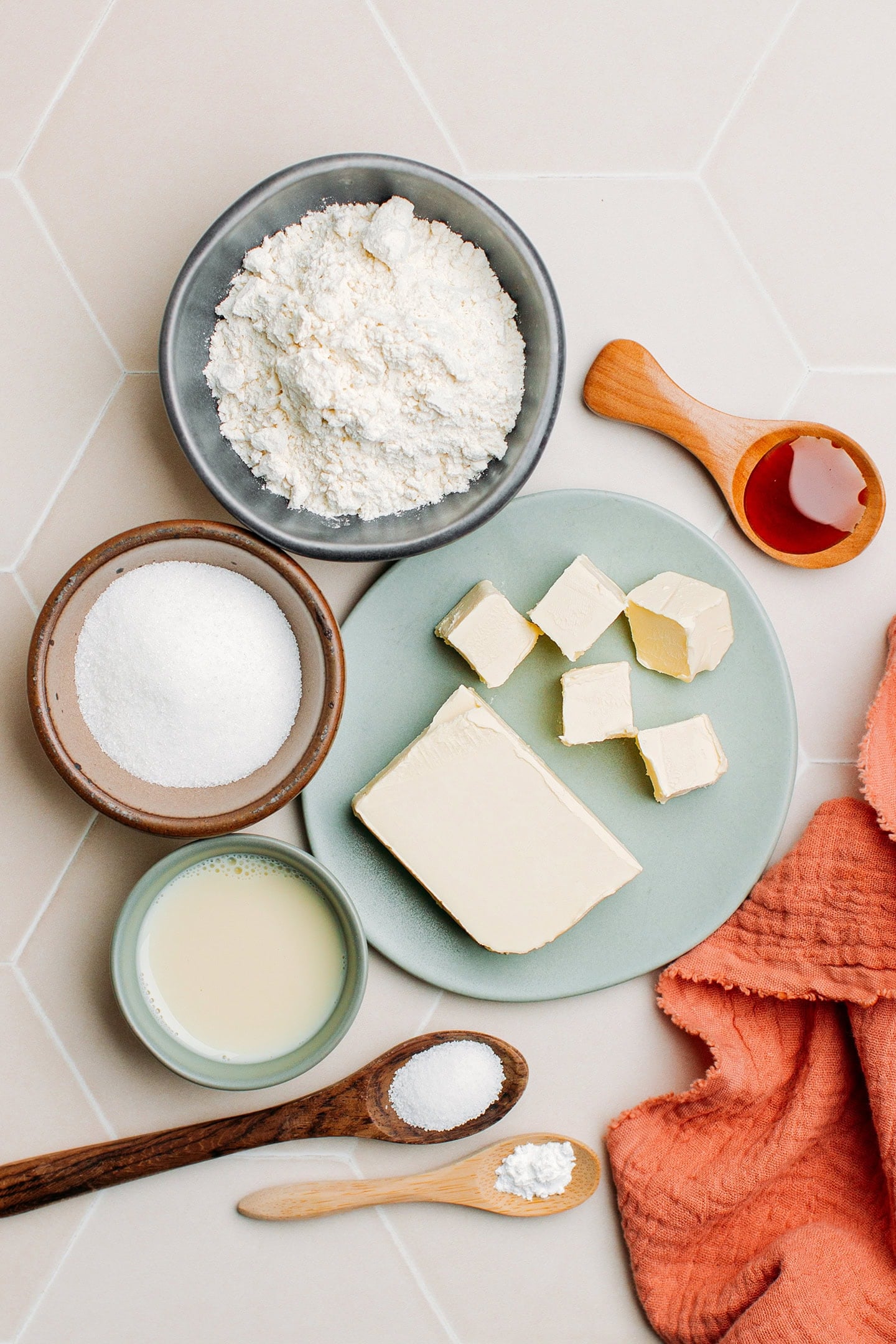 Ingredients like flour, sugar, butter, milk, and vanilla extract.