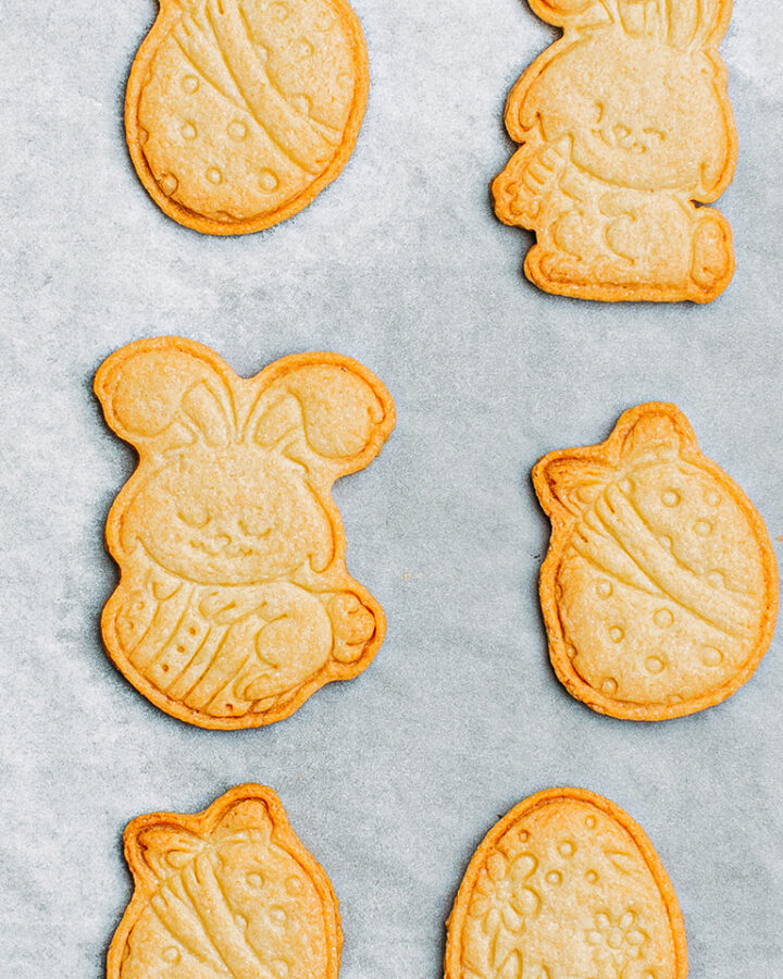 Baked sugar cookies on a baking sheet.