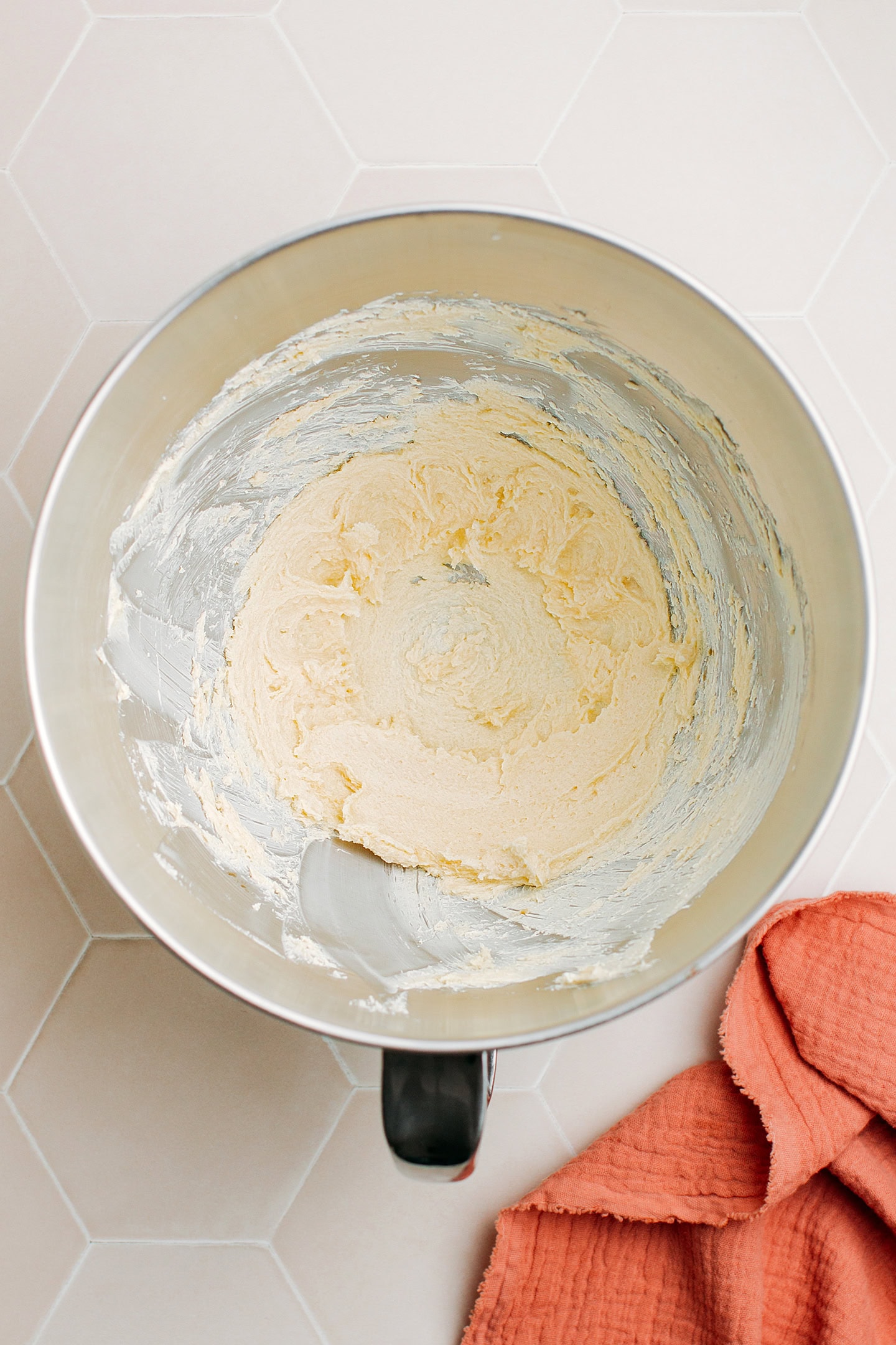 Creamed butter in the bowl of a stand mixer.