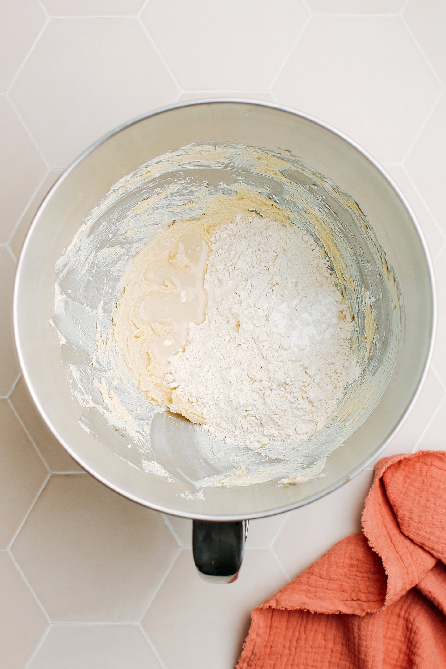 Creamed butter and flour in the bowl of a stand mixer.