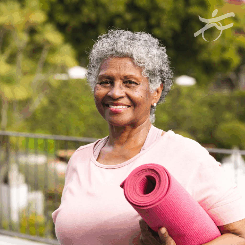 Woman with yoga mat smiling