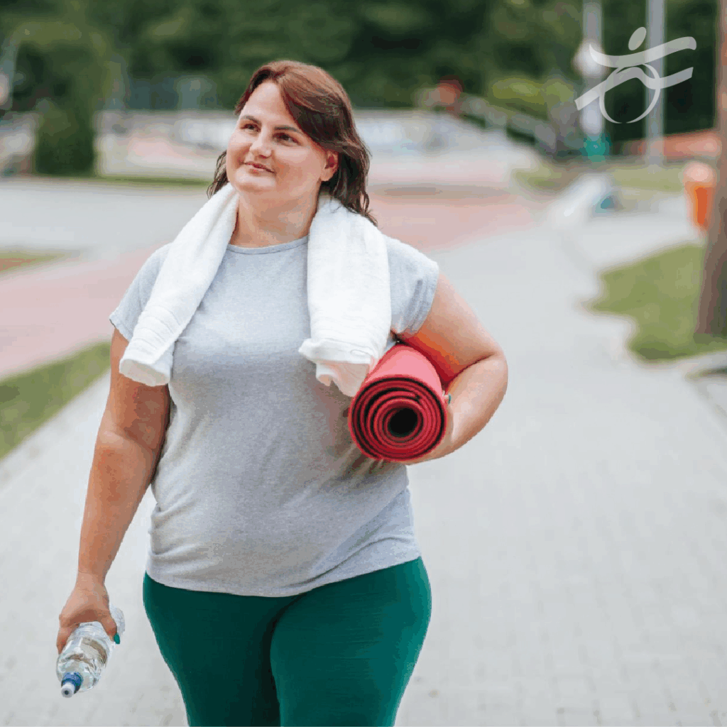 Woman with yoga mat walking outside