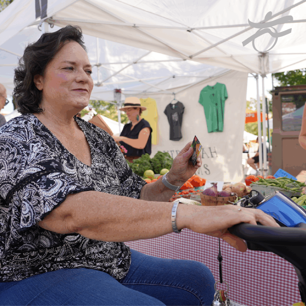 woman shopping at farmer's market