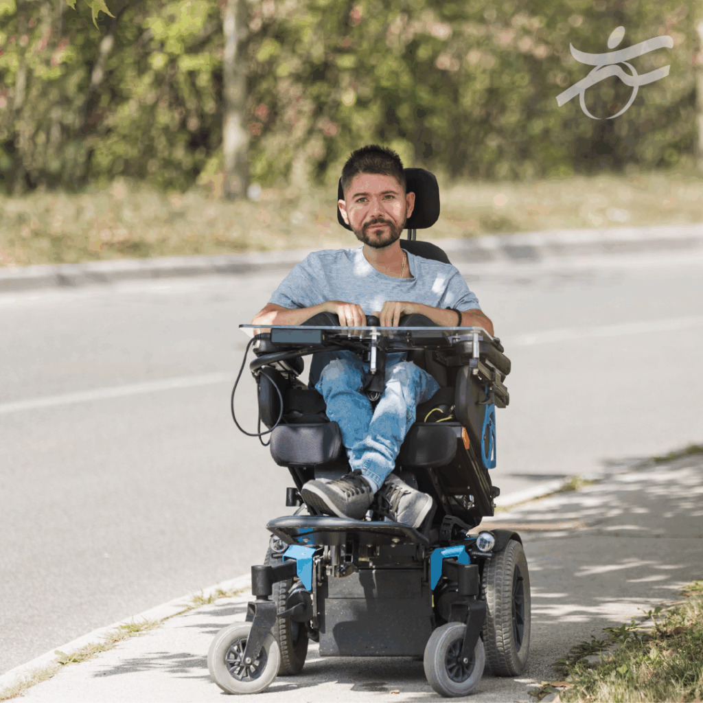Man who uses powerchair outside on a path