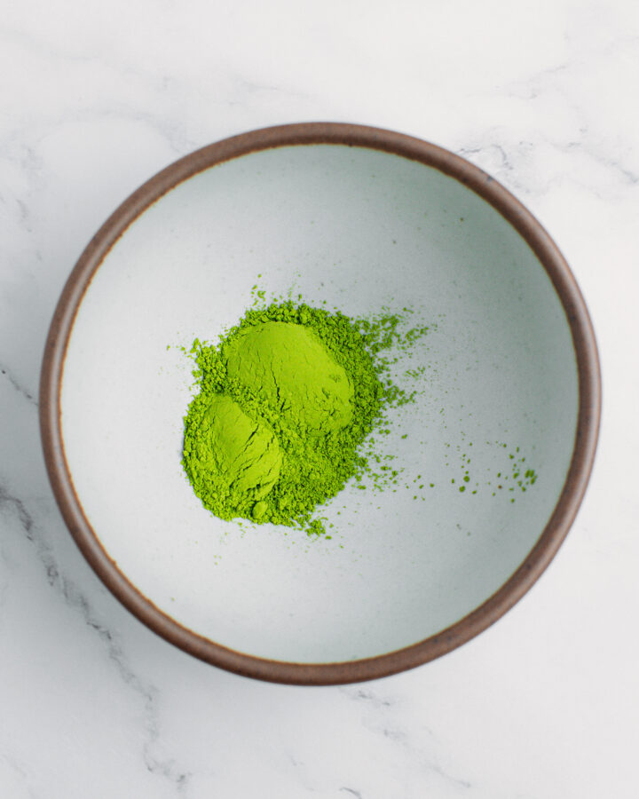 Matcha powder in a small bowl.