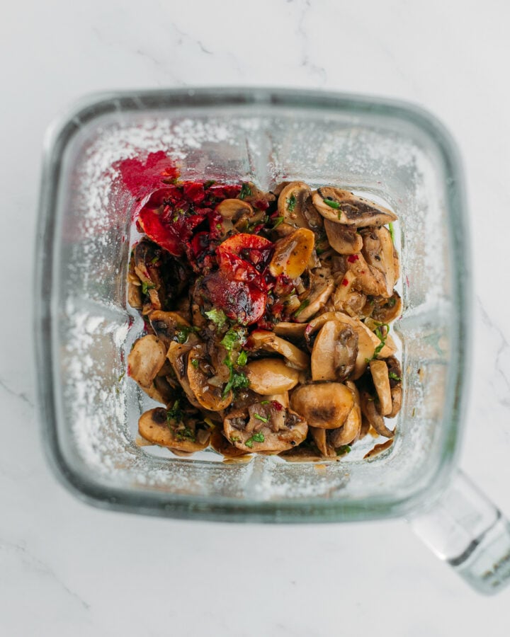 Sautéed mushrooms, melted butter, and red food coloring in a blender.