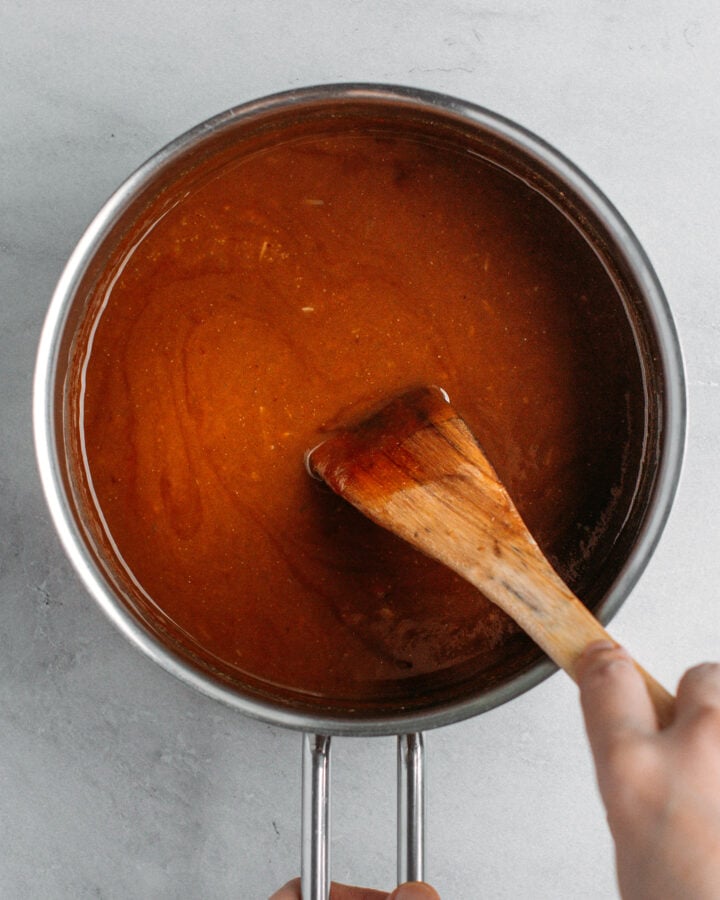 Homemade peanut dipping sauce in a saucepan.