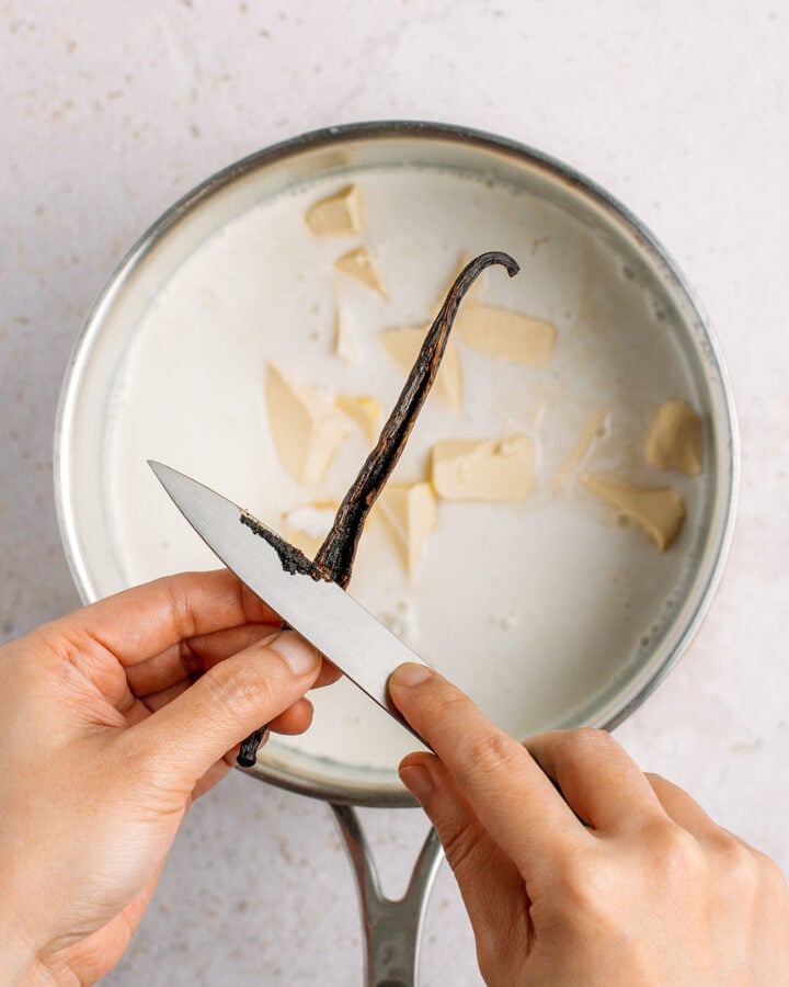 Scraping the seeds of a fresh vanilla bean.